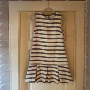 Blue and white striped dress with pleated bottom.